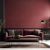 salon-z-czerwona-sciana-i-czarna-sofa-z-roslina-w-rogu
